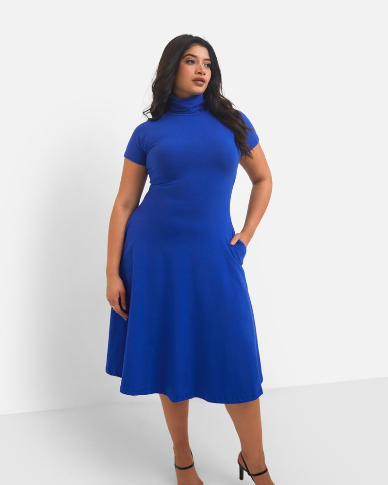 Front of a model wearing a size 2X Queen Bae Turtleneck Skater Midi Dress - Royal Blue in Royal Blue by Rebdolls. | dia_product_style_image_id:321472